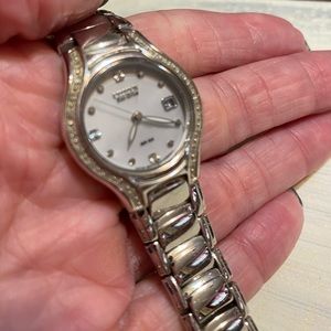 Citizen watch.  Mother of pearl face, accent diamonds.